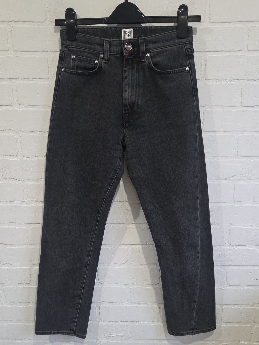 Toteme Twisted Slim Straight Jeans in Washed Black